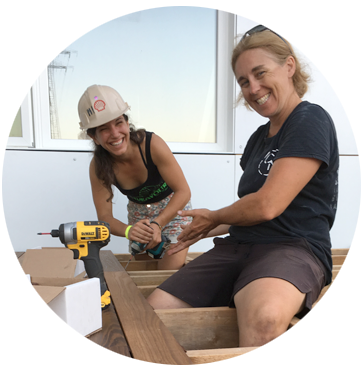 Class sitting on staircase listening to instructor