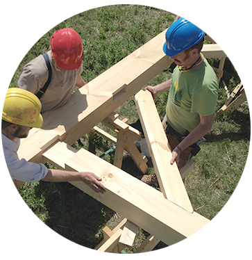 Group shot of students in front of building still under construction